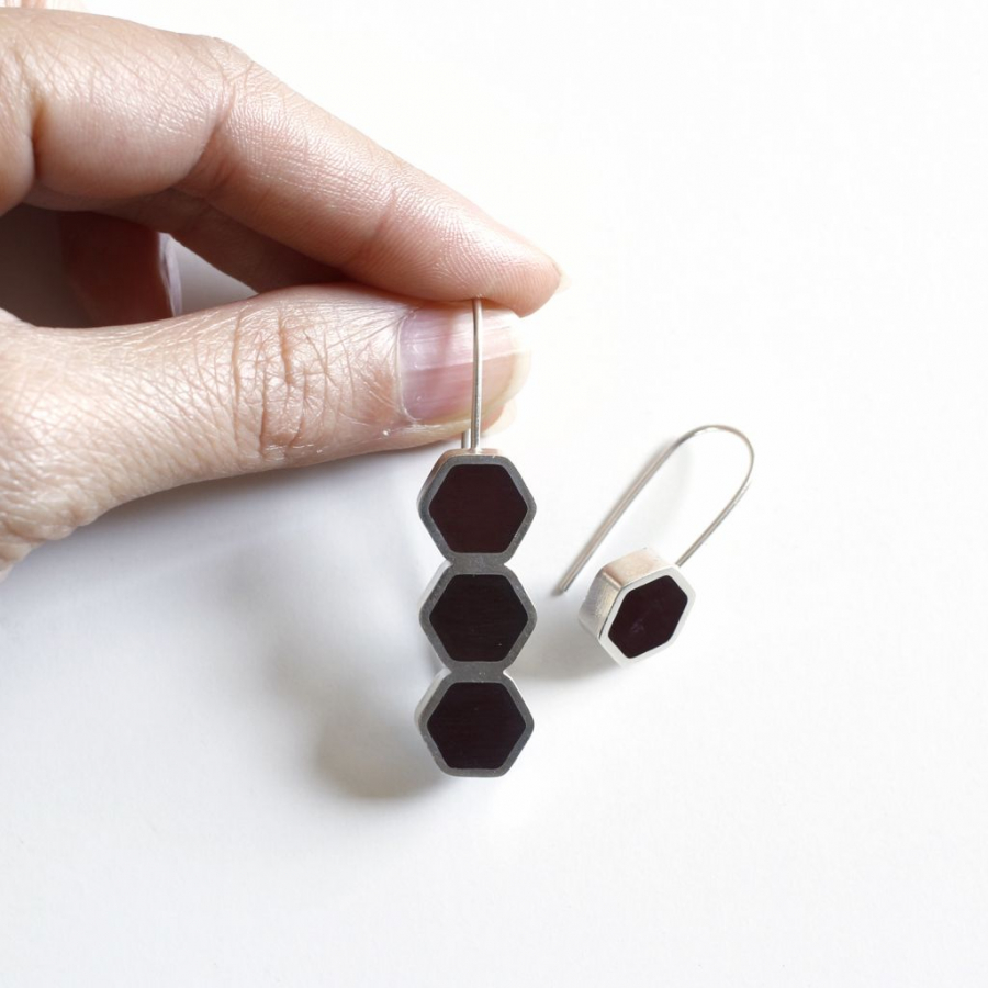 Modern mismatched silver and burgundy resin hexagon drop earrings