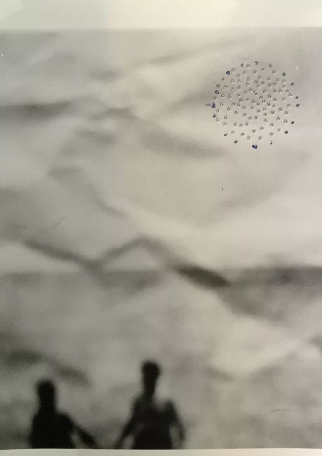 Silver gelatin print, punctured paper, blue ink