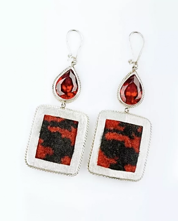 Handmade silver earrings with handwoven carpet