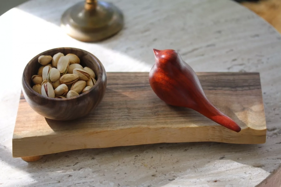Wooden bowl with hand carved wooden bird