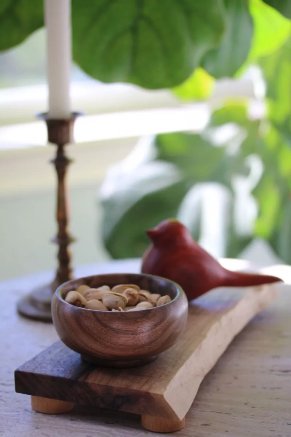 Wooden bowl with hand carved wooden bird