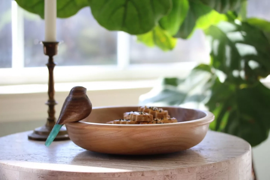 Wooden nuts bowl with hand carved bird 