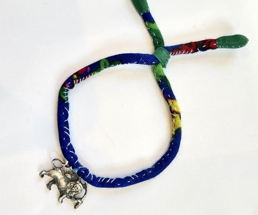 The Adjustable fabric with silver lion and sun Bracelet